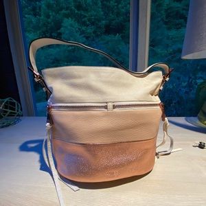 Aimee Kestenberg Rose gold striped purse.